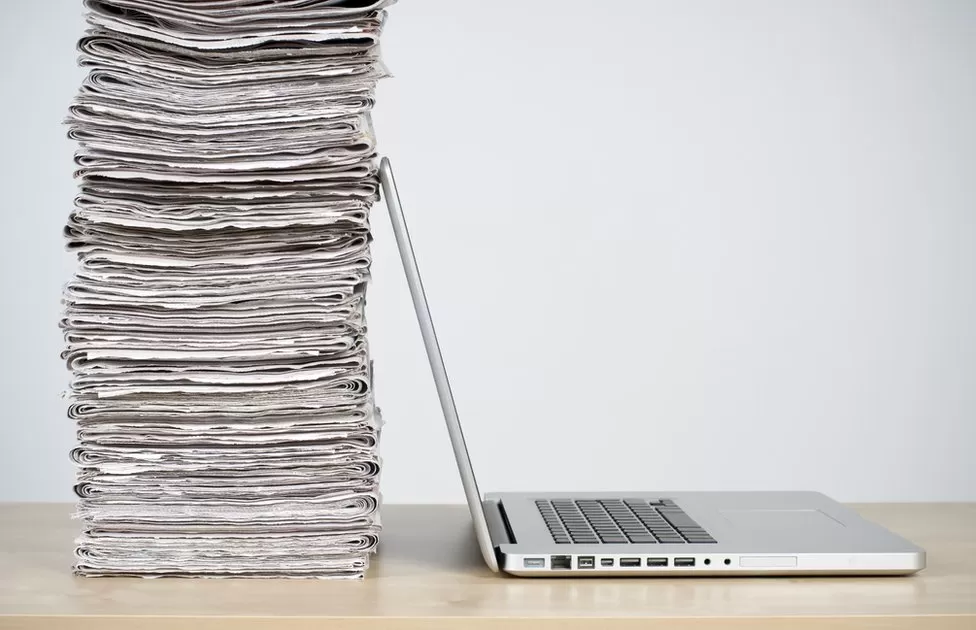 laptop-and-newspapers